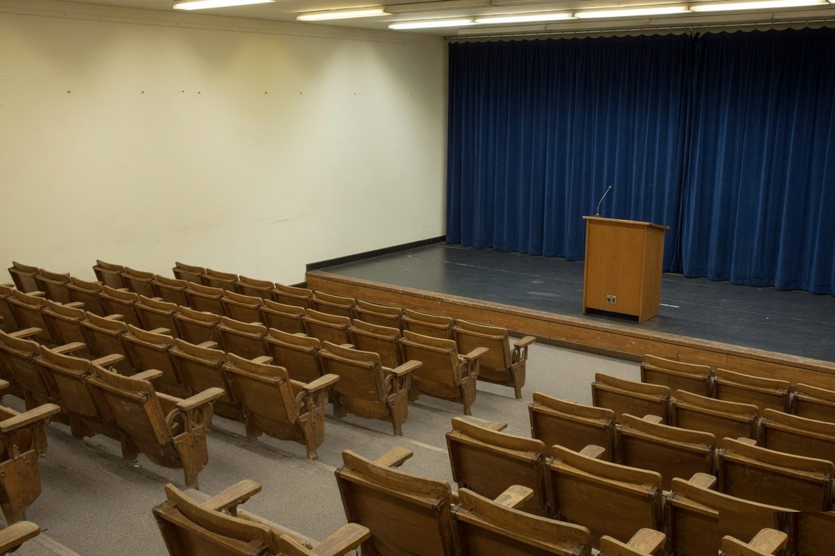 Illustrative photograph of an empty hall. It is not a photograph of a college event.